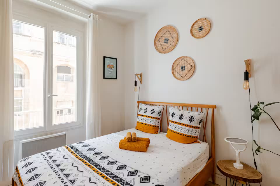SoleaStay Marseille — bedroom with French window and natural light